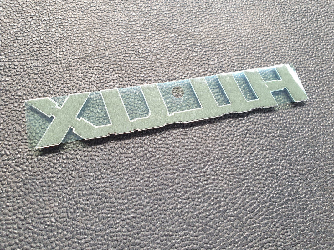 Toyota Hilux Front Door Badge "HILUX"
