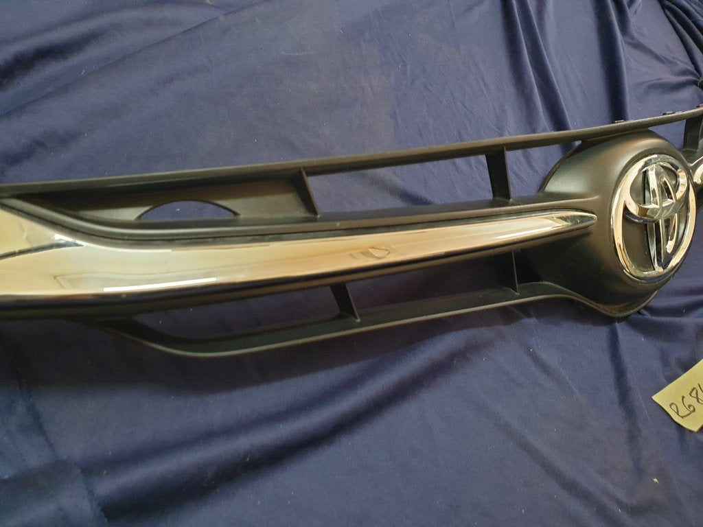 Toyota Starlet Radiator Grille - Light Wear and Tear, one clip broken