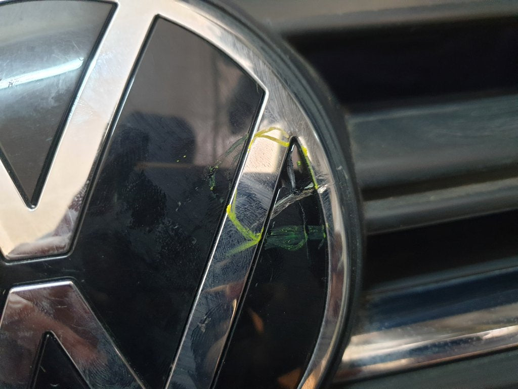 Volkswagen Polo 2018, 2019, 2020, 2021, 2022, 2023 Radiator Grille - Deep abrasion, Wear and Tear, Broken badge