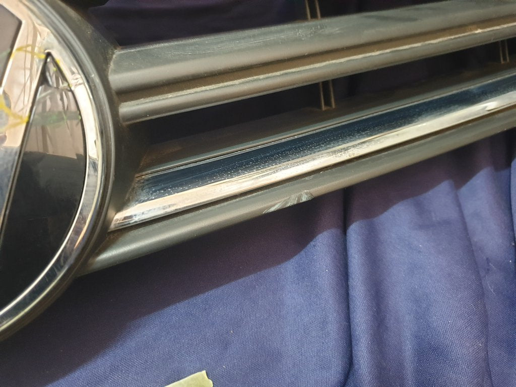 Volkswagen Polo 2018, 2019, 2020, 2021, 2022, 2023 Radiator Grille - Deep abrasion, Wear and Tear, Broken badge