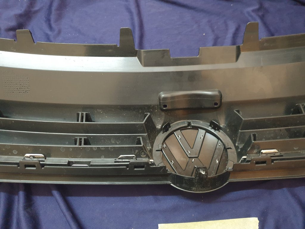 Volkswagen Polo 2018, 2019, 2020, 2021, 2022, 2023 Radiator Grille - Deep abrasion, Wear and Tear, Broken badge