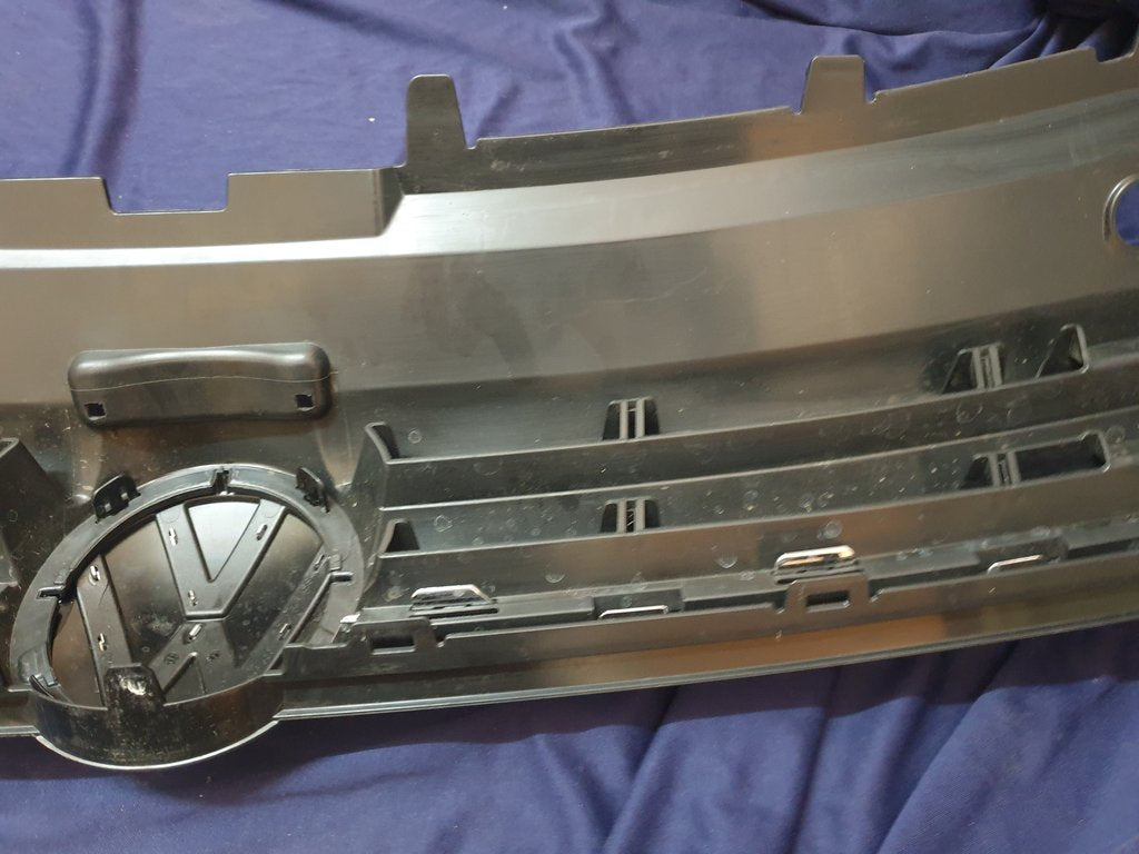 Volkswagen Polo 2018, 2019, 2020, 2021, 2022, 2023 Radiator Grille - Deep abrasion, Wear and Tear, Broken badge