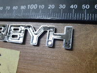 Original Used Toyota Corolla Cross XS Boot Lid 'HYBRID' Badge
