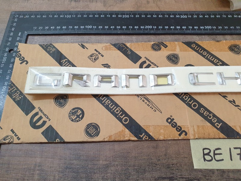 Original New Jeep Grand Cherokee Front Door 'GRAND CHEROKEE' Badge