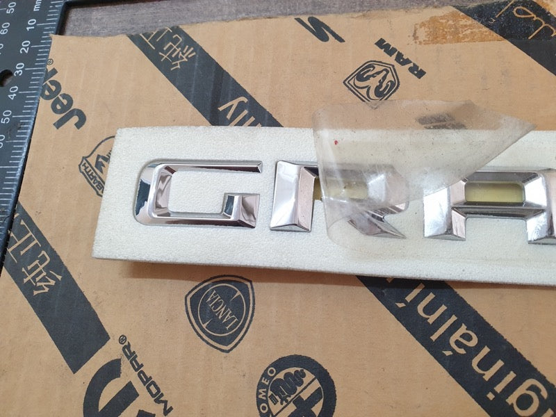 Original New Jeep Grand Cherokee Front Door 'GRAND CHEROKEE' Badge