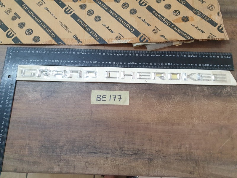 Original New Jeep Grand Cherokee Front Door 'GRAND CHEROKEE' Badge