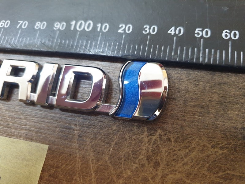 Original Used Toyota Corolla Cross Front Fender 'HYBRID' Badge