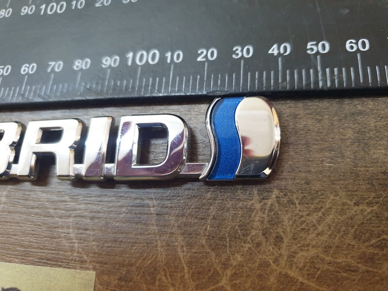 Original Used Toyota Corolla Cross Front Fender 'HYBRID' Badge