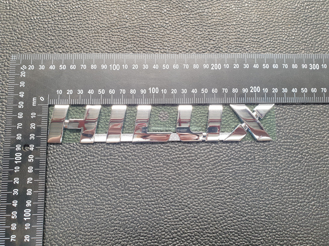 Toyota Hilux Front Door Badge "HILUX"