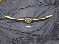 Toyota Starlet Radiator Grille - Light Wear and Tear, one clip broken