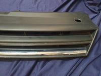 Volkswagen Polo 2018, 2019, 2020, 2021, 2022, 2023 Radiator Grille - Deep abrasion, Wear and Tear, Broken badge